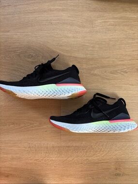 Nike Black Running Shoes with Neon Green and Coral Details